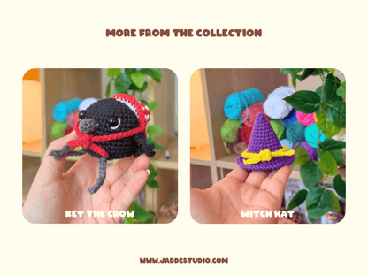 A promotional collage with the heading 'MORE FROM THE COLLECTION' showing two handmade crocheted plush items held in a hand: a black crow wearing a red Santa hat and scarf labeled 'REY THE CROW,' and a small purple witch hat with a yellow bow labeled 'WITCH HAT.' The background is a light cream color with decorative plants and colorful yarn balls.