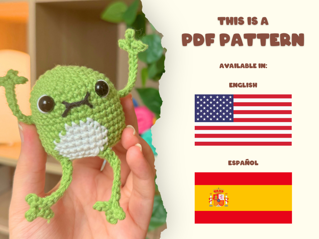 A hand holds a small crocheted green frog toy on the left, with a torn-paper style divider on the right showing text that says 'THIS IS A PDF PATTERN' and flags for English and Spanish.