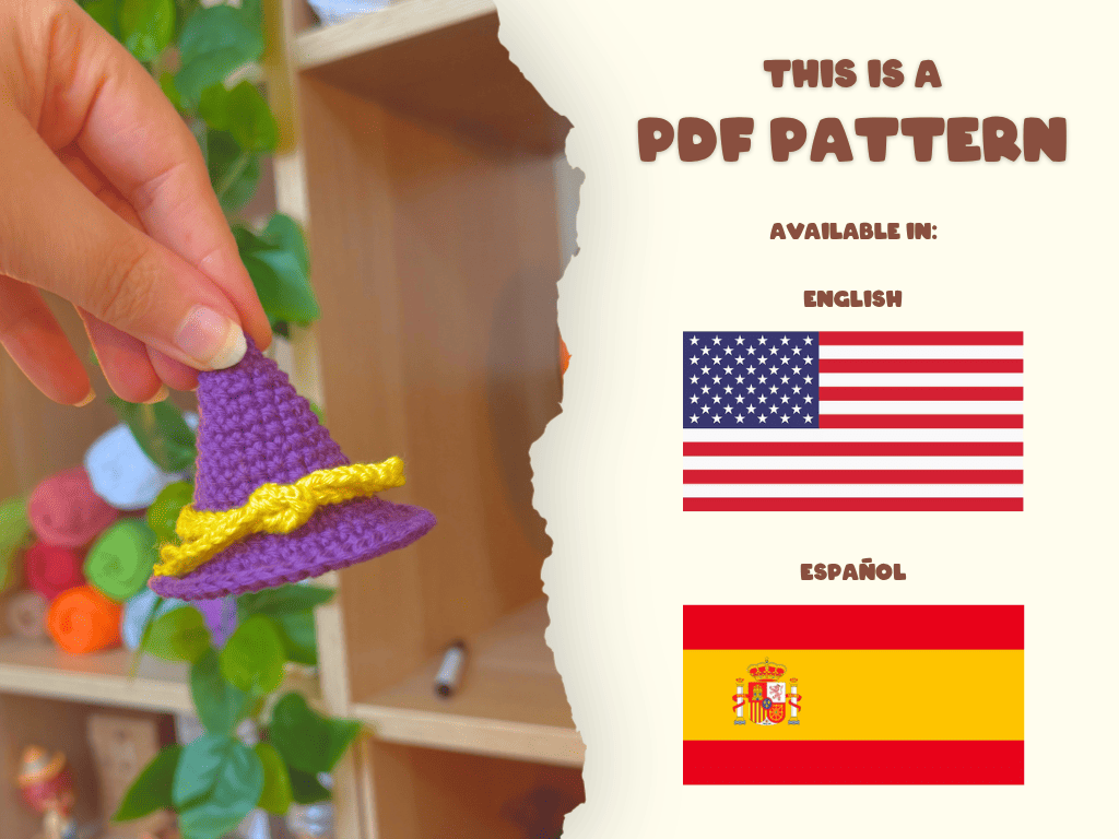 A hand holds a small crocheted purple witch hat with a yellow band on the left, while the right side of the image shows a cream-colored panel with text reading 'THIS IS A PDF PATTERN' and flags for English and Español.