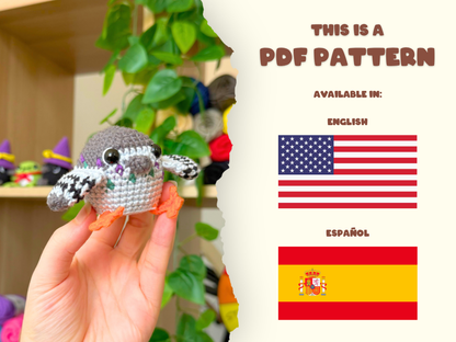 A hand holds a small crocheted bird toy on the left, while the right side of the image is a cream-colored panel with text reading 'THIS IS A PDF PATTERN' and flags for English and Spanish.