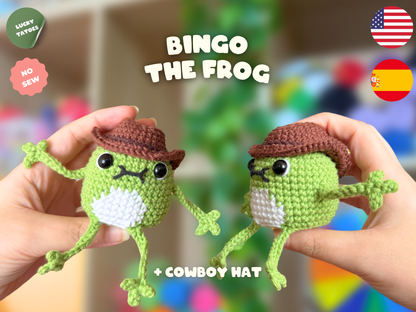 Two hands holding handmade crochet frog-themed pigeon toys wearing brown cowboy hats, with text overlays reading 'BINGO THE FROG' and '+ COWBOY HAT' on a colorful blurred background.